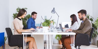 Men and women working in office