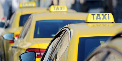 detail of yellow taxi cars on the street