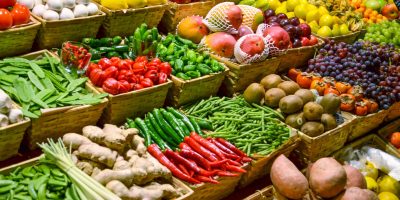 Fruit market with various colorful fresh fruits and vegetables